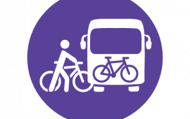 Icon of person with a bicycle going onto a bus