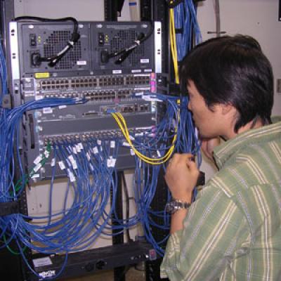 Man working with network switches